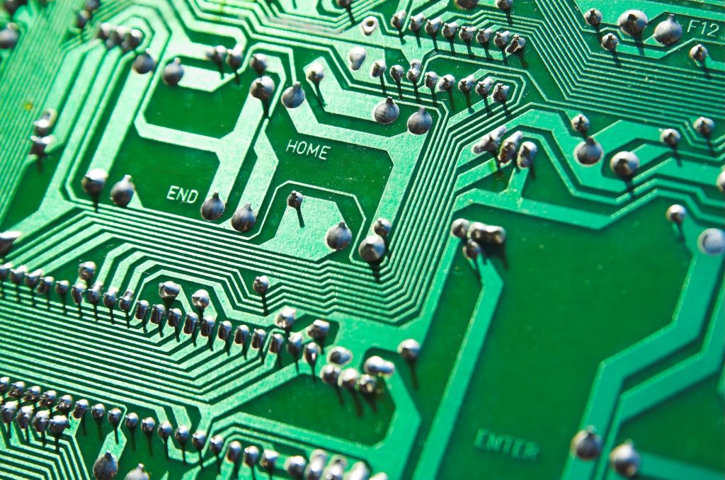 Extreme closeup of green circuit board